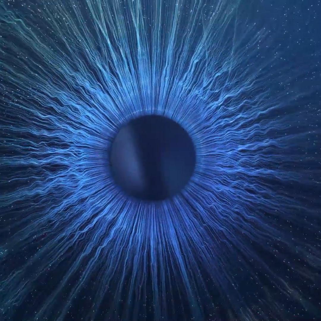 ZEISS Group International motion - a close up of a blue eyeball in the dark