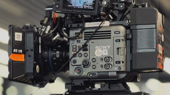 Professional cinema camera setup featuring a ZEISS lens mounted on a SONY camera rig with stabilization equipment.
