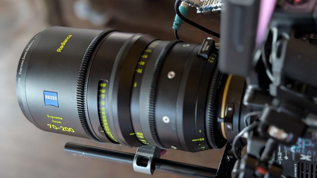 Close-up of a ZEISS Supreme Prime 70-200mm Radiance camera lens mounted on professional filming equipment.