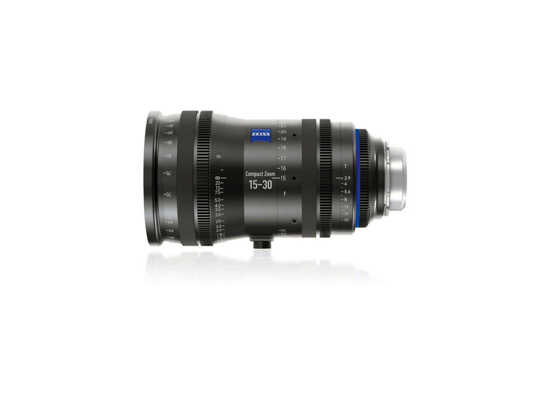 Side view of a ZEISS Compact Zoom 15-30mm camera lens with branding and focal length markings visible.