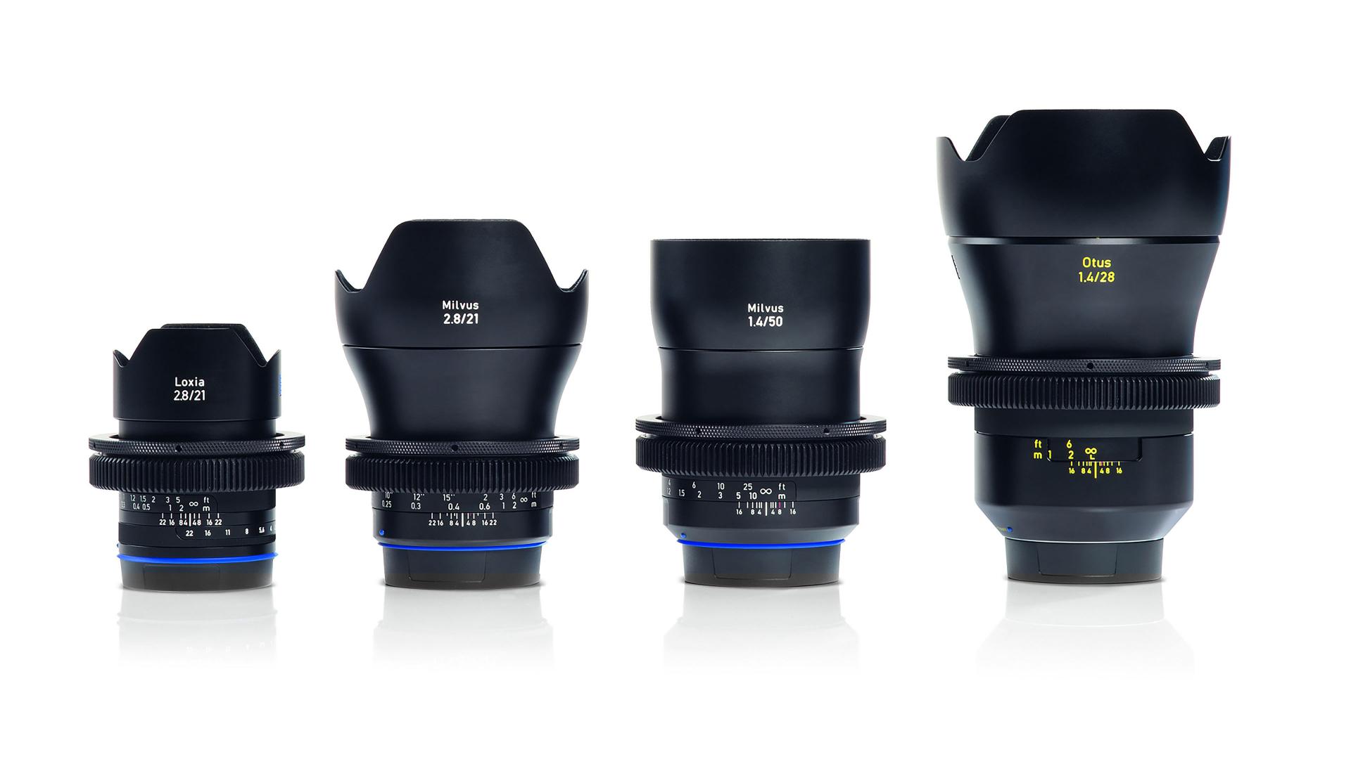 Four ZEISS camera lenses of varying sizes are displayed side by side on a white background.