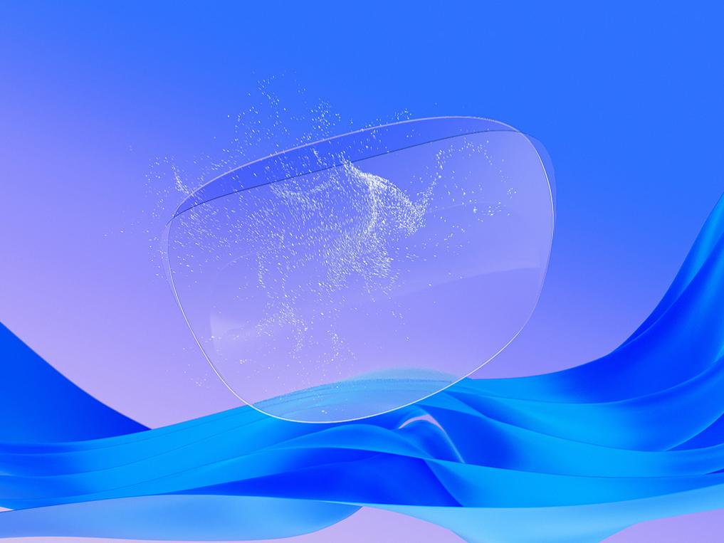 Illustration 3D en images de synthèse d'un verre de lunettes transparent sur lequel est appliqué un traitement de lunettes antistatique prouvant sa capacité à repousser les particules de poussière et à maintenir une surface propre.