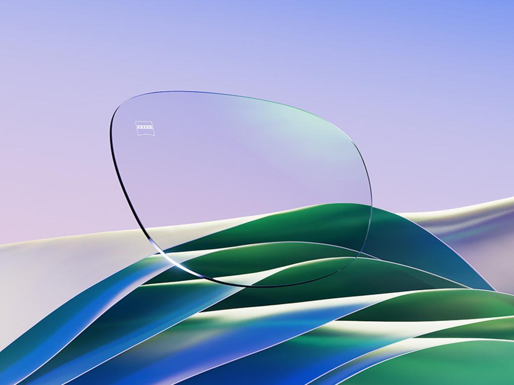 Représentation en images de synthèse d'un verre blanc de lunettes avec un subtile reflet vert.